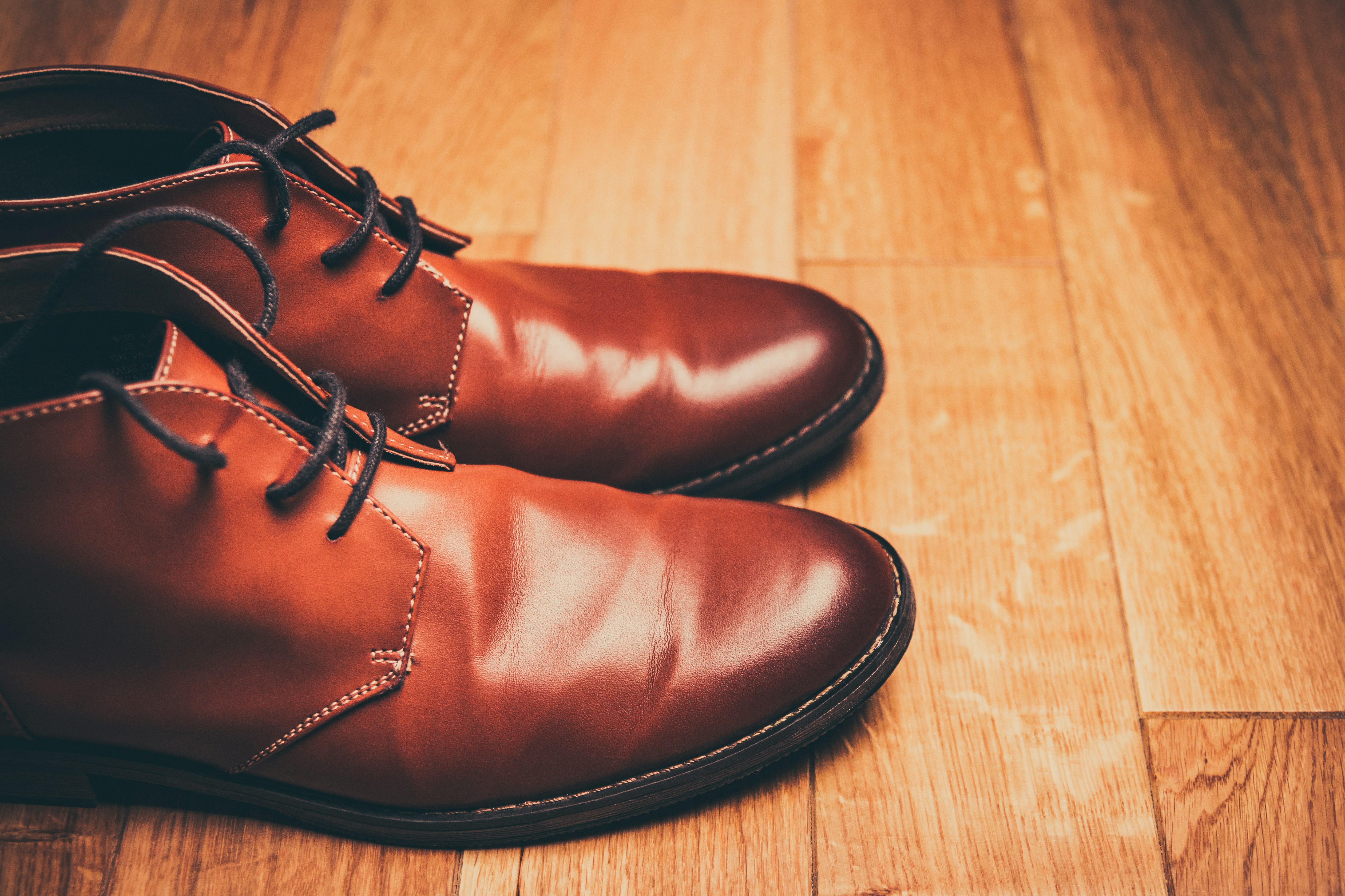 pair of brown leather lace-up boots